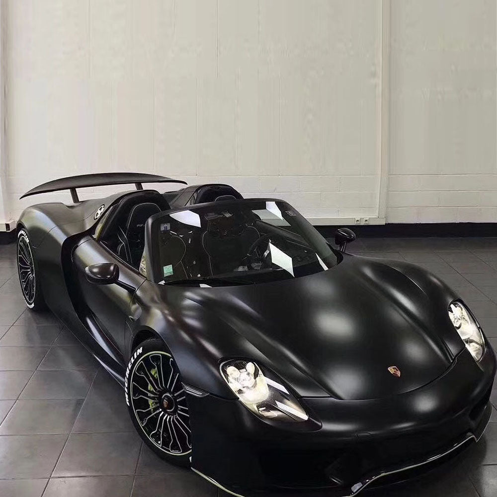 Porsche 918 Spyder wrapped in Black Matte vinyl in a white studio