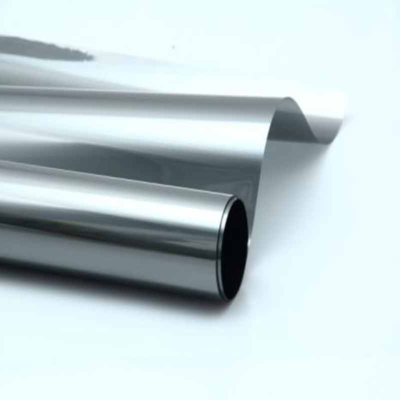 Roll of CCM2070 ceramic window tint film partly unrolled on a white surface
