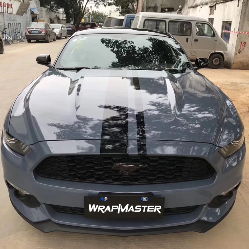 Ford Mustang wrapped in Cement Grey Gloss vinyl with black hood stripes, front view